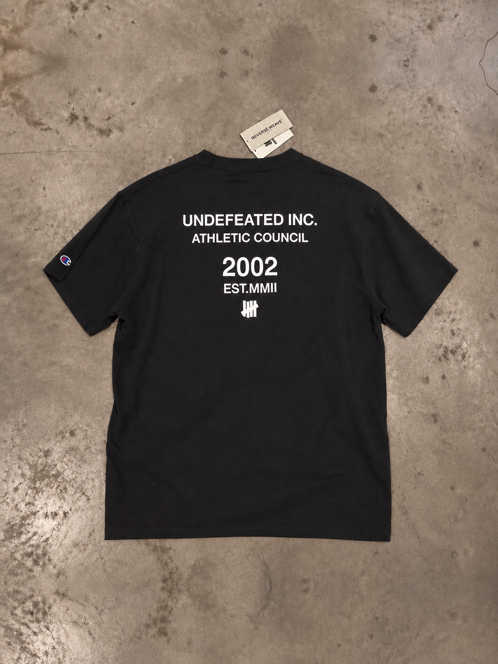Undefeated × Champion Reverse Weave Athletic Council Pocket Tee – Black