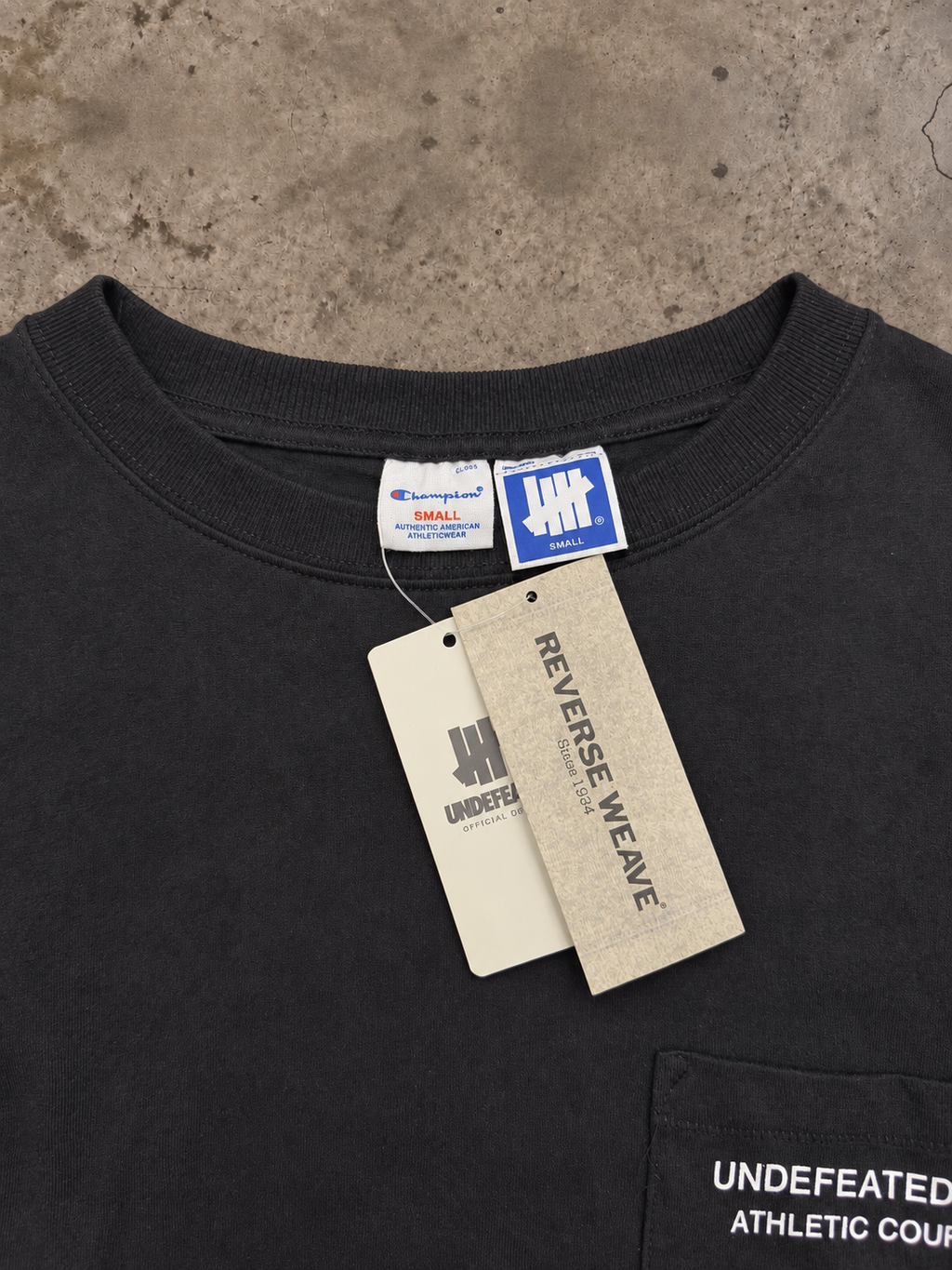 Undefeated × Champion Reverse Weave Athletic Council Pocket Tee – Black